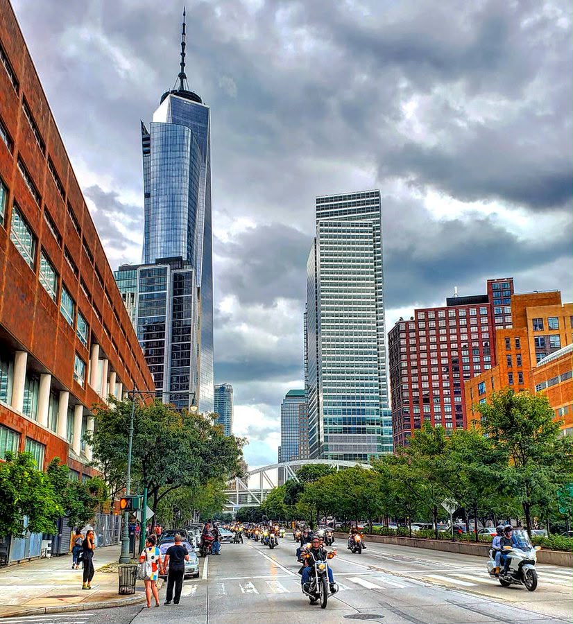 Riders passing One World Trade Center