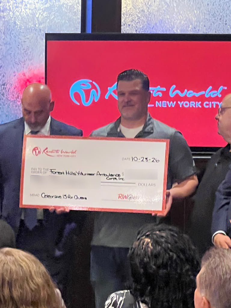 FHVAC accepts a donation check from Resorts World New York City